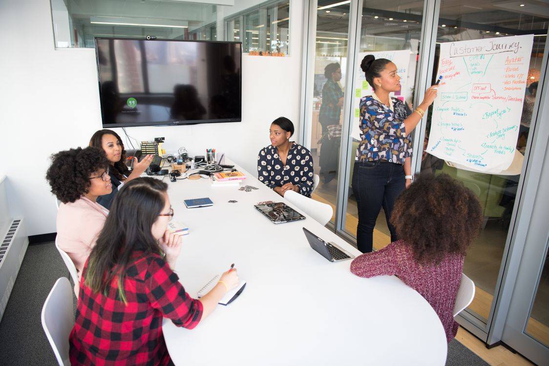 Professionals networking at an industry event for talent acquisition