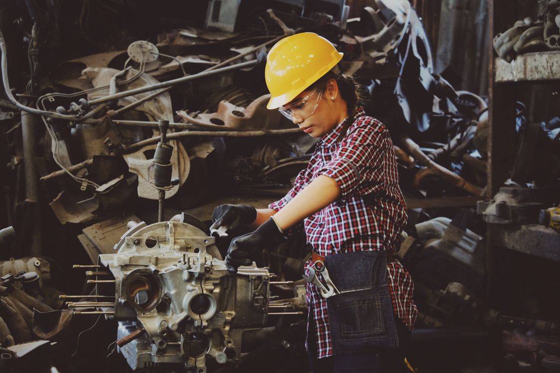 Factory workers on a manufacturing production line in India